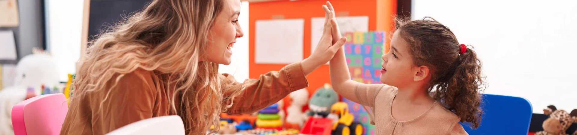image of woman and girl high fiving
